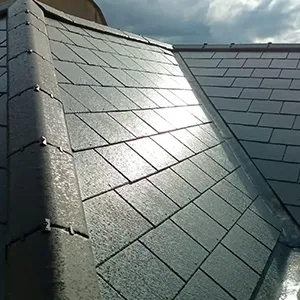 a close up of a roof with a sky background