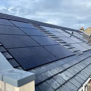 a solar panel on the roof of a house