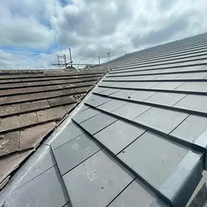 the roof of a building with a sky background