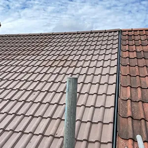 the roof of a building with a sky background