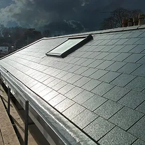 a man standing on the roof of a building