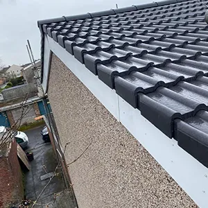 the roof of a building with a black gutter